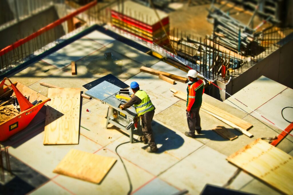 two construction workers working on a site