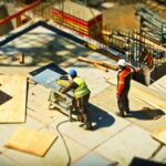 two construction workers working on a site